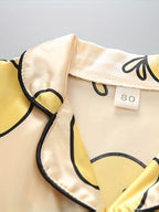 Pijamas infantiles con estampado de pato y sandalias ligeras de diseño elástico
