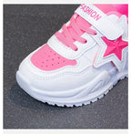 Pink and white kids' sneaker with star design and velcro strap for comfort and style