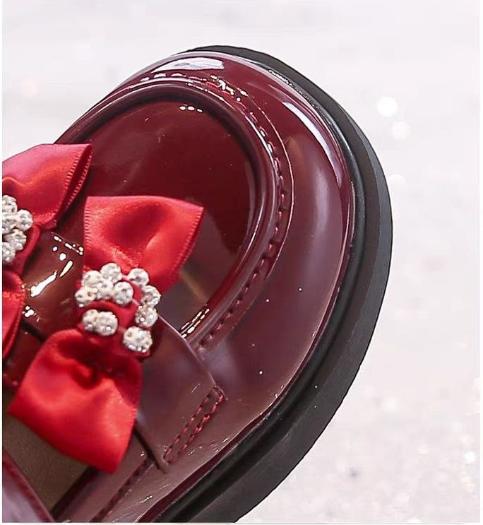 Zapato elegante para niñas con lazo adornado y colores brillantes vista lateral
