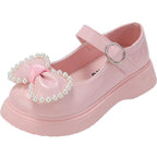 Zapato para niña con diseño de moño adornado con perlas en España