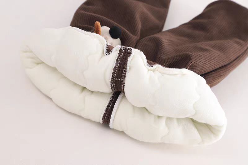Brown corduroy kids pants with white quilted lining and snowman detail, cozy winter wear