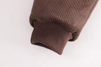 Brown ribbed knit sleeve cuff, soft children's clothing detail for comfort and style