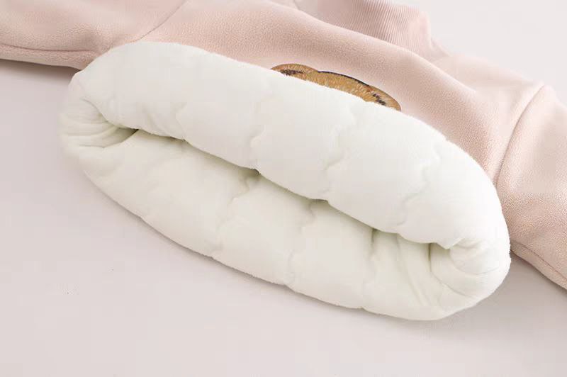 Soft pink kids' hoodie with cozy white quilted lining for warmth and comfort
