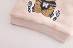 Pink kids sweatshirt with embroidered bear in sports jersey, soft fabric, ribbed cuffs