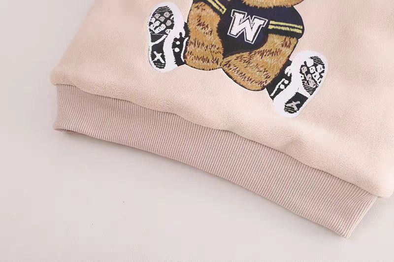 Pink kids sweatshirt with embroidered bear in sports jersey, soft fabric, ribbed cuffs