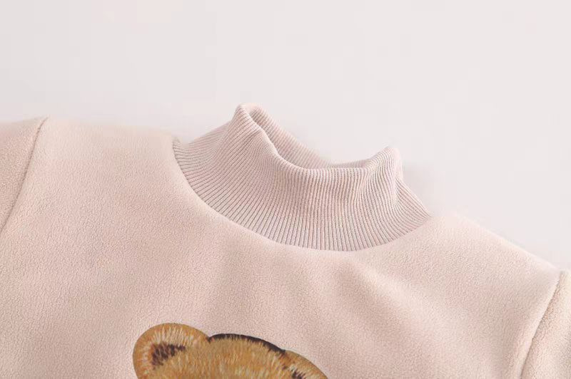 Soft pink kids sweater with teddy bear print and ribbed turtleneck, cozy children's clothing