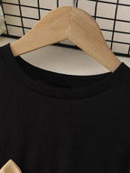 Vestido de tul bordado con manga larga y cinturón de satén dorado