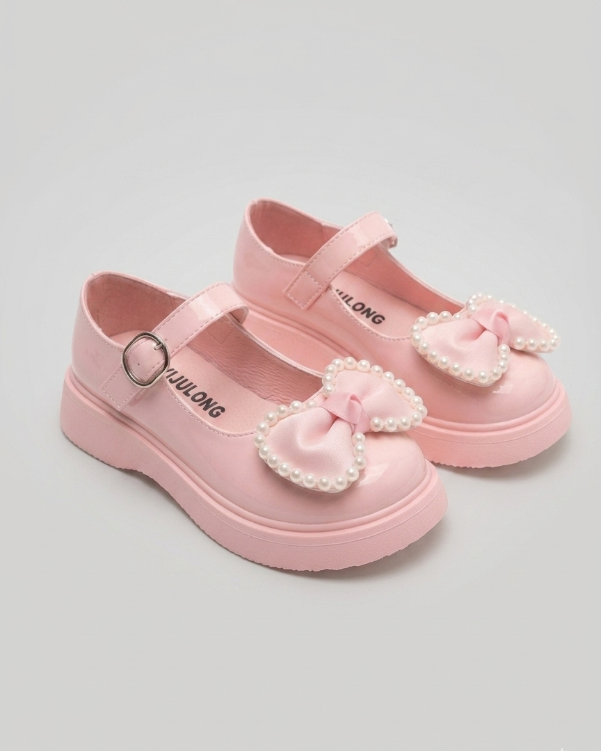 Zapato para niña con diseño de moño adornado con perlas en España