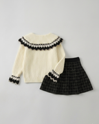 Conjunto niña invierno 2 piezas cárdigan de punto y falda estampada ,destacada para looks elegantes y sencillos en España