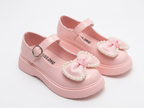 Zapato para niña con diseño de moño adornado con perlas en España