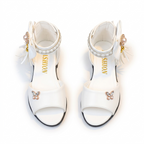 Sandalias decoradas con lazo y cuentas de perla para niñas en España