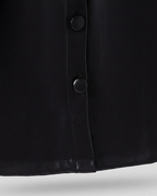 Abrigo niña piel sintética negro estilo gabardina elegante con cinturón ajustable en España
