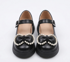 Zapato para niña con diseño de moño adornado con perlas en España