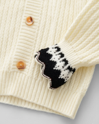 Conjunto niña invierno 2 piezas cárdigan de punto y falda estampada ,destacada para looks elegantes y sencillos en España