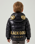 Chaqueta bebé niña y niño invierno impermeable negra con detalles dorados y capucha con orejitas en España