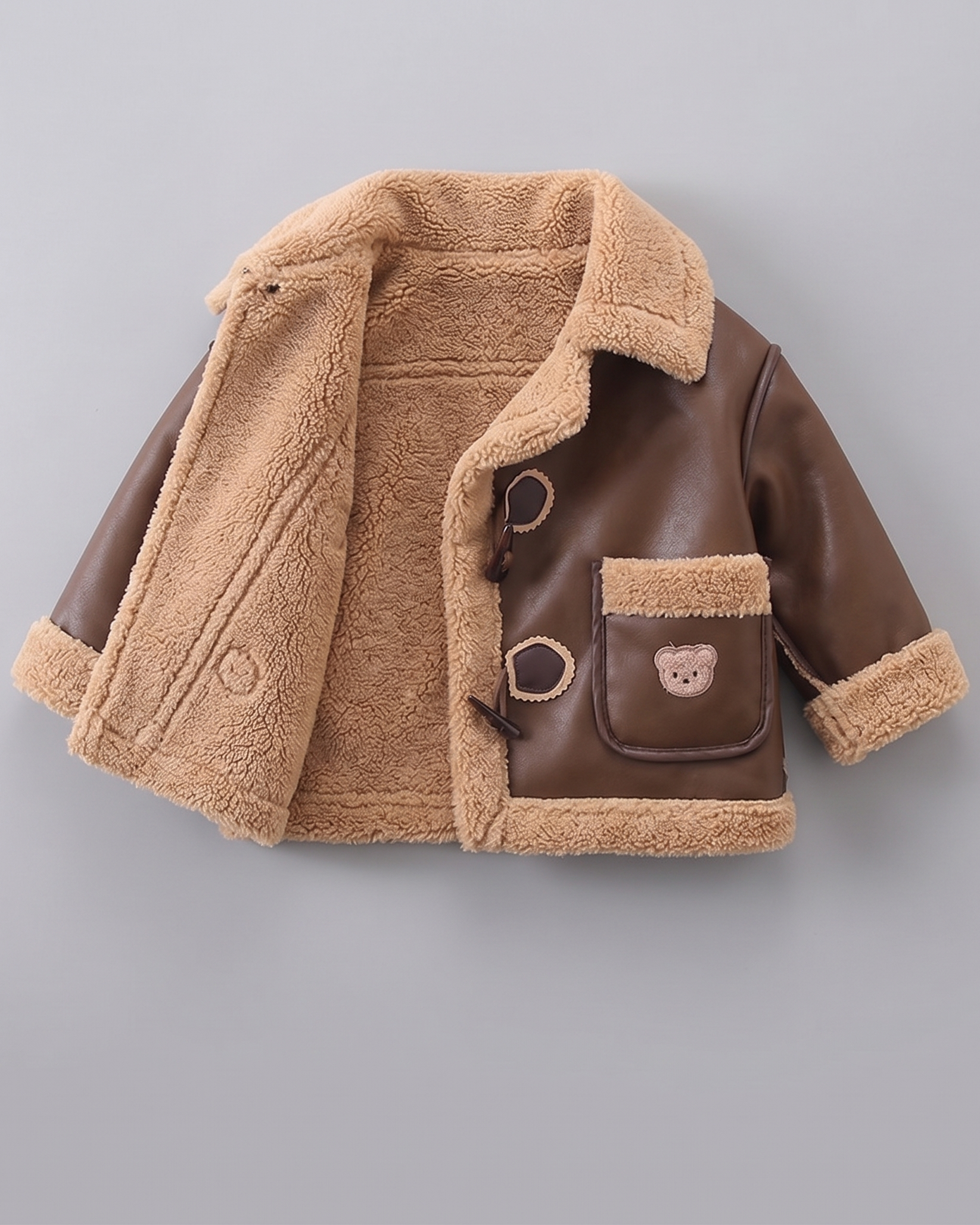 Chaqueta de invierno niño y niña estilo cuero con forro sherpa cálido en España