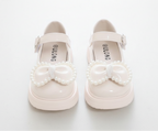 Zapato para niña con diseño de moño adornado con perlas en España