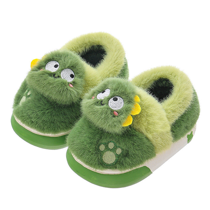 Green dinosaur-themed kids slippers with fuzzy texture and playful design