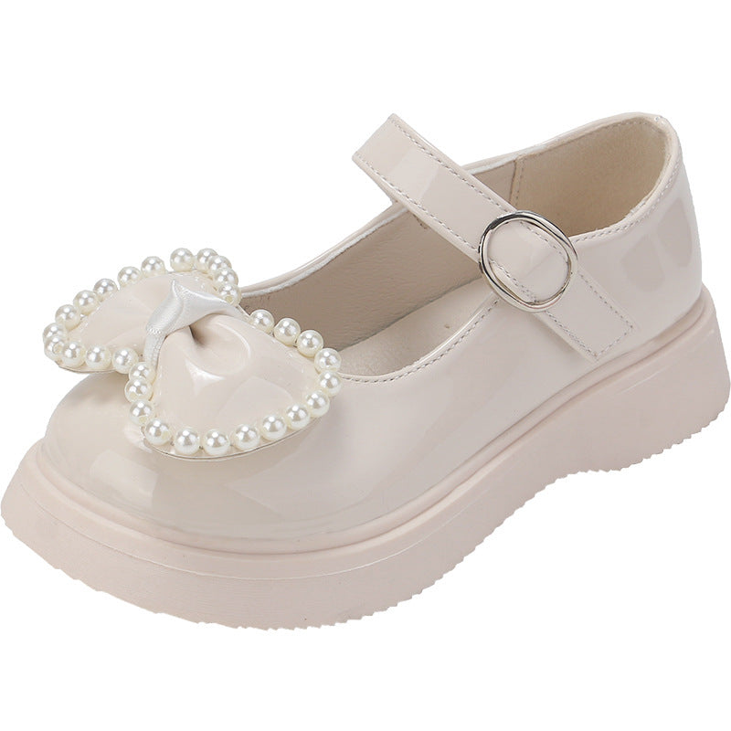 Zapato para niña con diseño de moño adornado con perlas en España