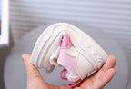Zapato deportivo con combinación de colores rosa y blanco, de diseño moderno para niñas en España