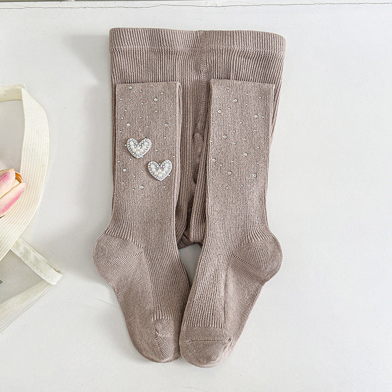 Kids' beige tights with rhinestone hearts and dots, soft ribbed knit for toddler comfort and style