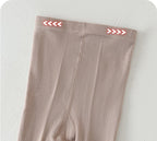 Soft beige kids leggings with red arrow details, cozy and stretchy for children's comfort
