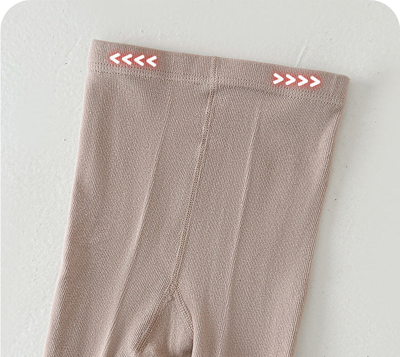 Soft beige kids leggings with red arrow details, cozy and stretchy for children's comfort
