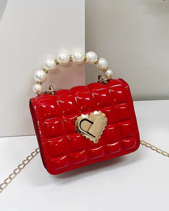 Bolso niña perlas con cadena dorada y cierre corazón
