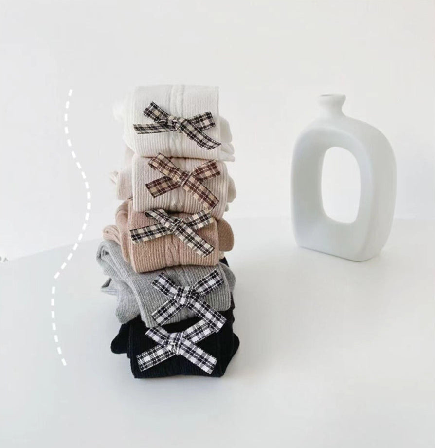 Kids' ribbed tights with plaid bows in white, beige, gray, black — soft, cozy, stylish infant wear