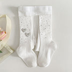White kids' socks with rhinestone hearts and dots, soft ribbed knit for comfort and style