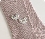 Pink kids' tights with pearl heart embellishments and rhinestone details, soft knit fabric for comfort