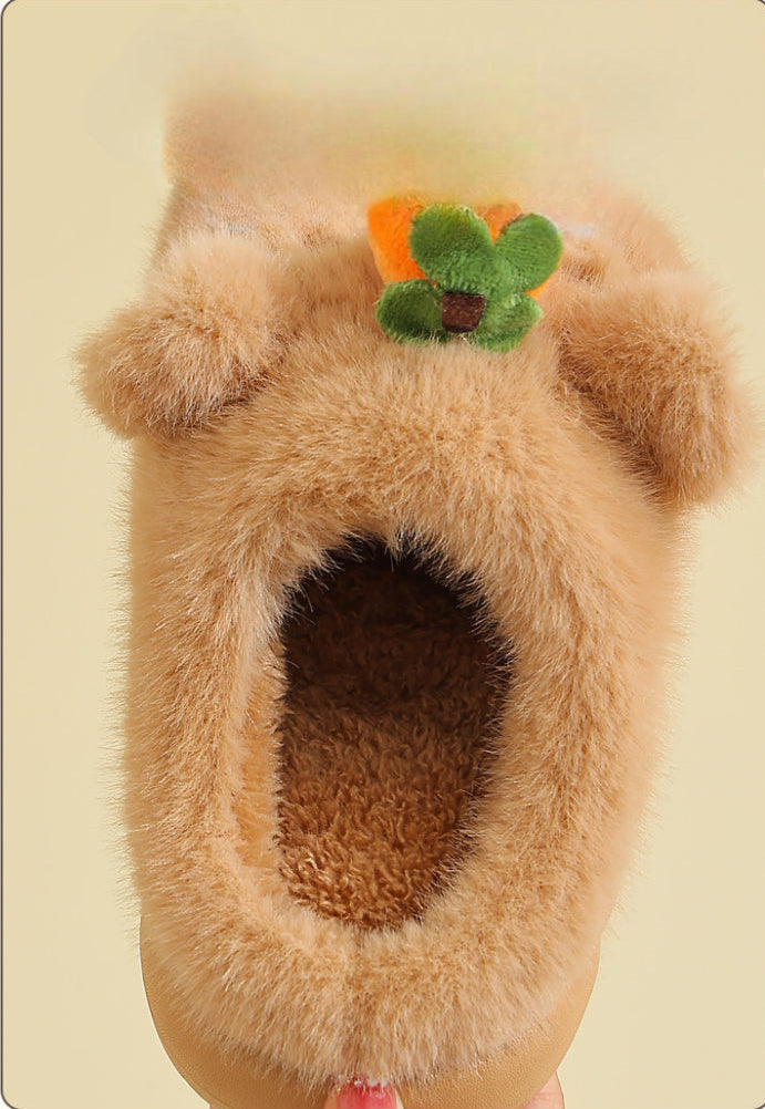 Soft fuzzy baby slippers with cute bear ears and flower detail, cozy infant footwear