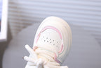 Zapato deportivo con combinación de colores rosa y blanco, de diseño moderno para niñas en España