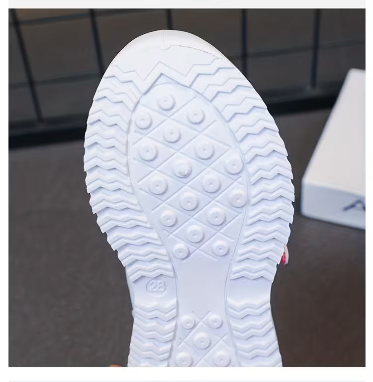 White kids sneaker sole with zigzag tread and grip dots, size 28, for comfortable play