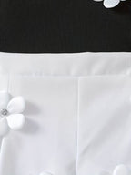 Conjunto de niña con top de espalda cruzada y shorts con flores 3D