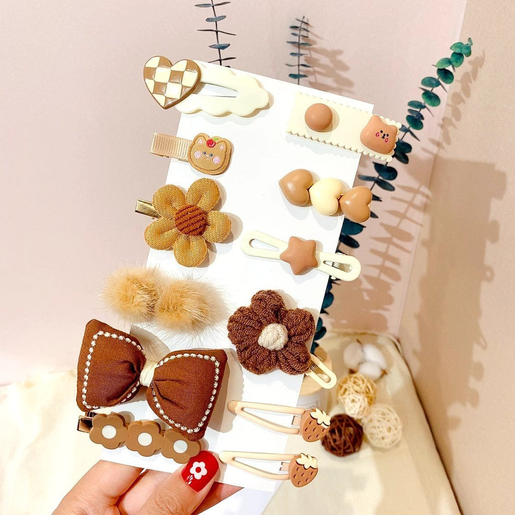 Pinzas para el cabello de niños con diseños decorativos: flores y formas adorables