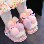 Pantuflas de invierno cálidas para niños con peluche suave y bolas de colores en España